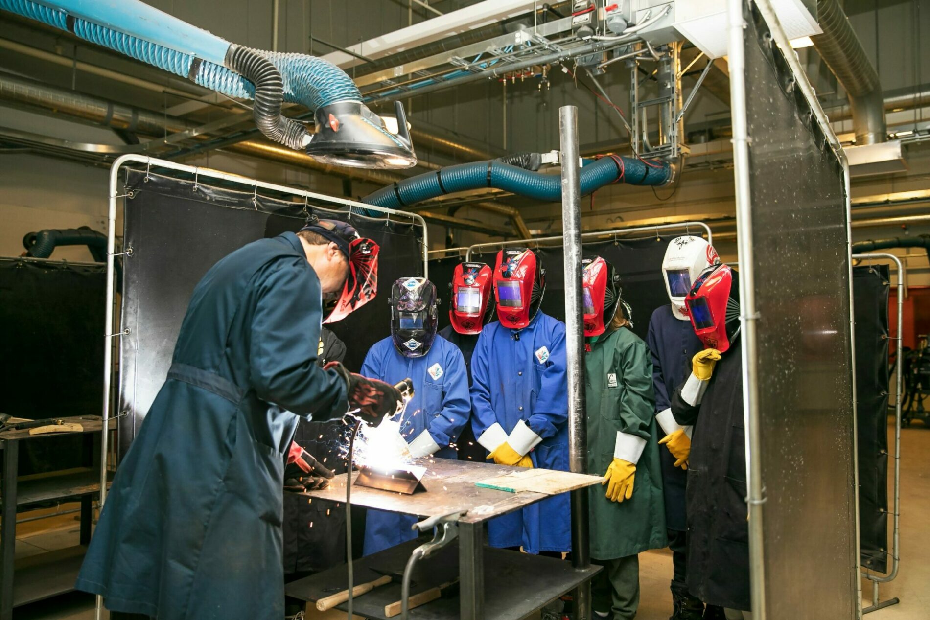 Group of people in a welding class