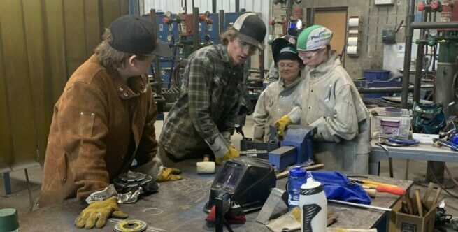 Youth learning about welding