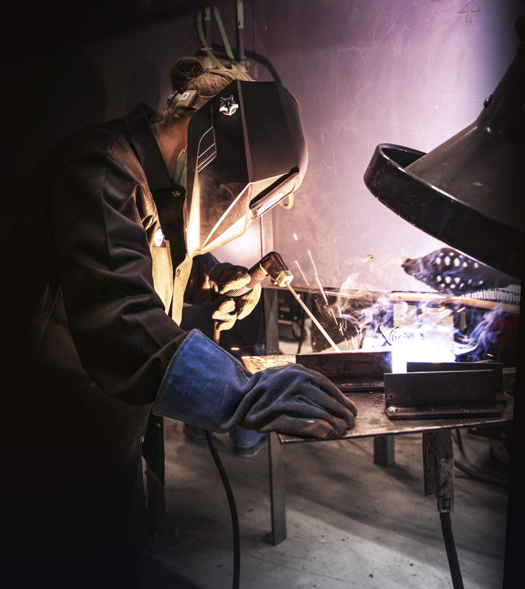 Woman of Steel participant welding a T joint in the horizontal position using the Shielded Metal Arc welding process.
